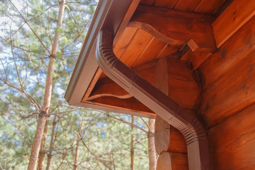 Picture of gutter system on log house.